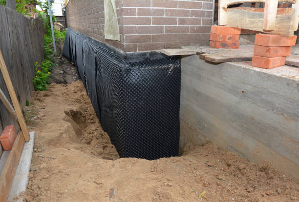 Happy homeowners after waterproofing job in Iron Ridge